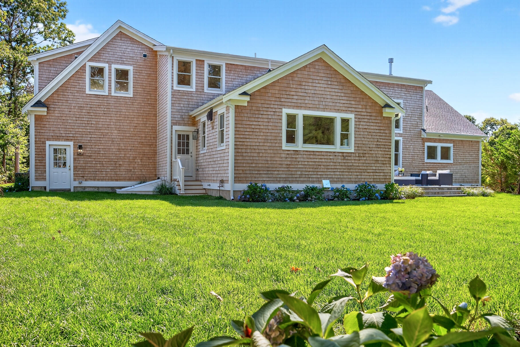 79 Rivers Edge Road East Falmouth, MA 02536 - Photo 73 of 104 a front view of house with yard and green space