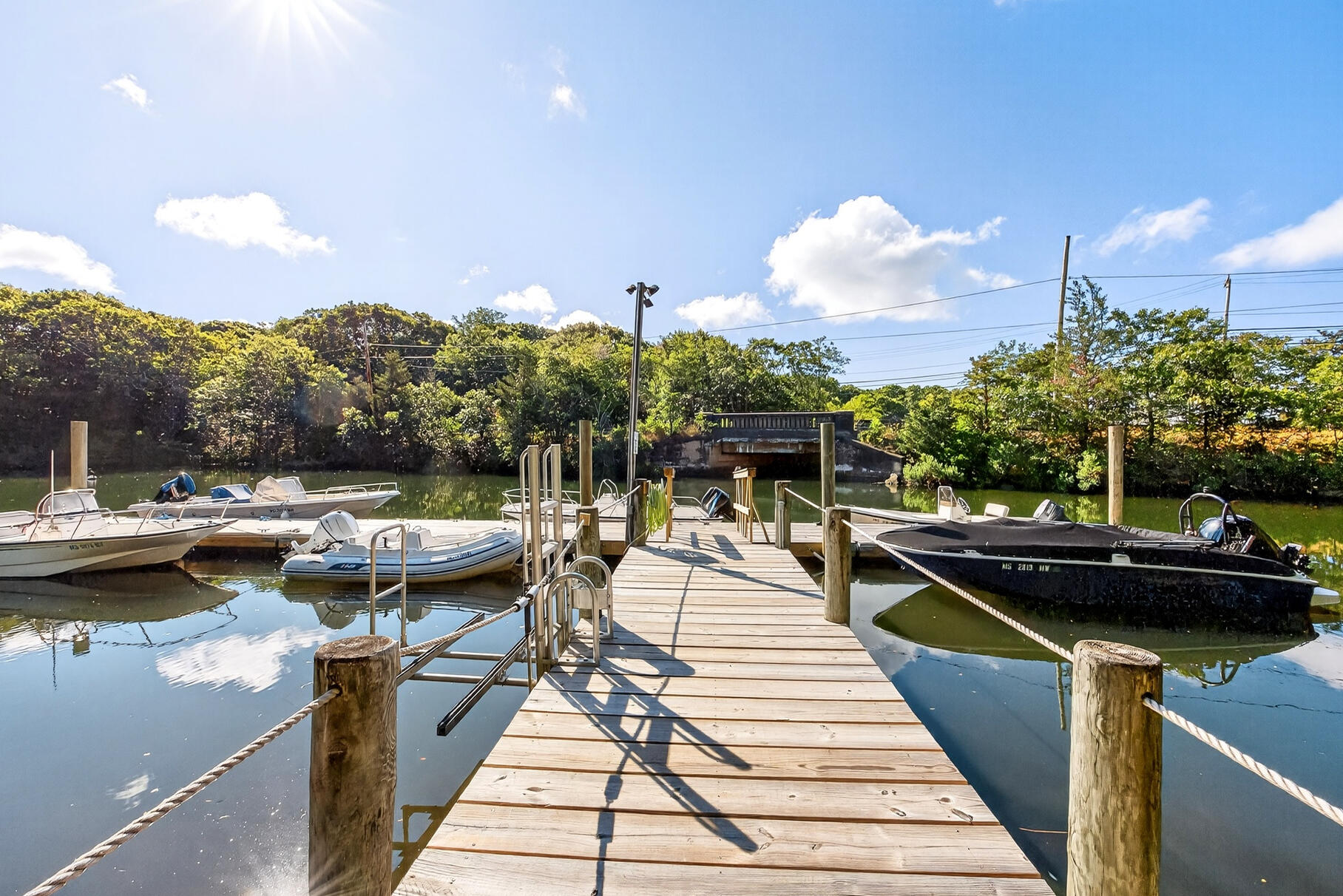 79 Rivers Edge Road East Falmouth, MA 02536 - Photo 89 of 104 a view of a swimming pool with a patio and couches chairs