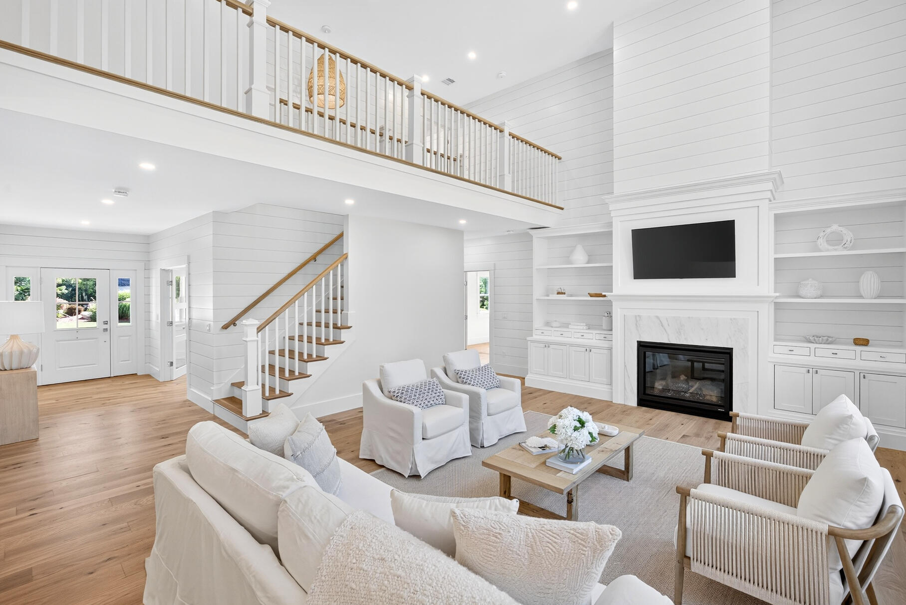 79 Rivers Edge Road East Falmouth, MA 02536 - Photo 9 of 104 a living room with furniture a fireplace and a flat screen tv
