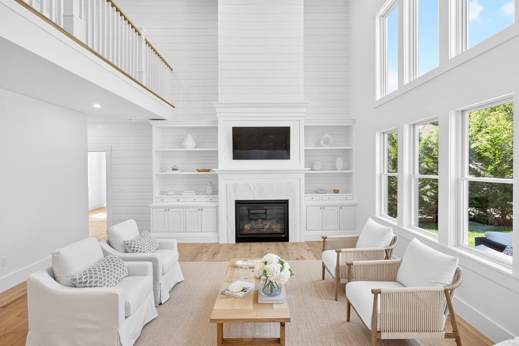 79 Rivers Edge Road East Falmouth, MA 02536 - Photo 10 of 104 a living room with furniture a fireplace and a flat screen tv