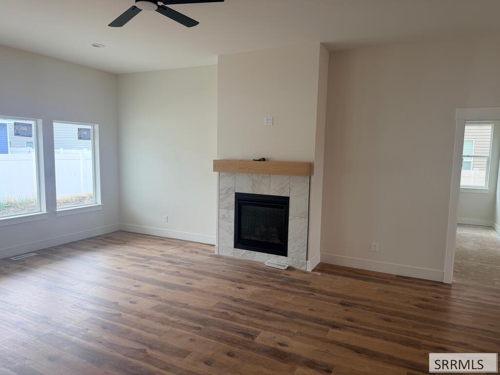 172 Kiana Avenue Rigby, ID 83442 - Photo 6 of 33 Tiled Gas fireplace, Wow, No lights on