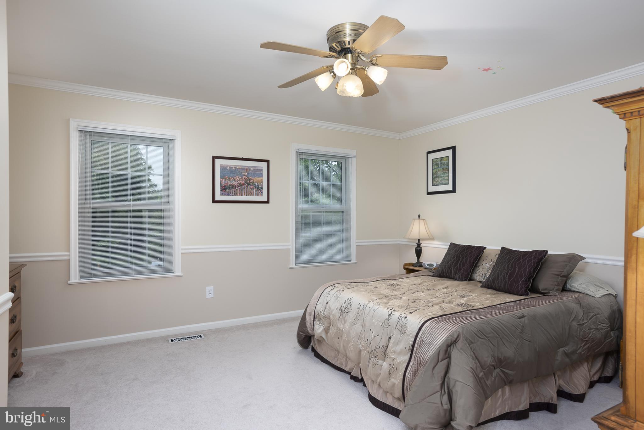 9550 Ridgeview Drive Columbia, MD 21046 - Photo 20 of 30 a bedroom with a large bed and a window
