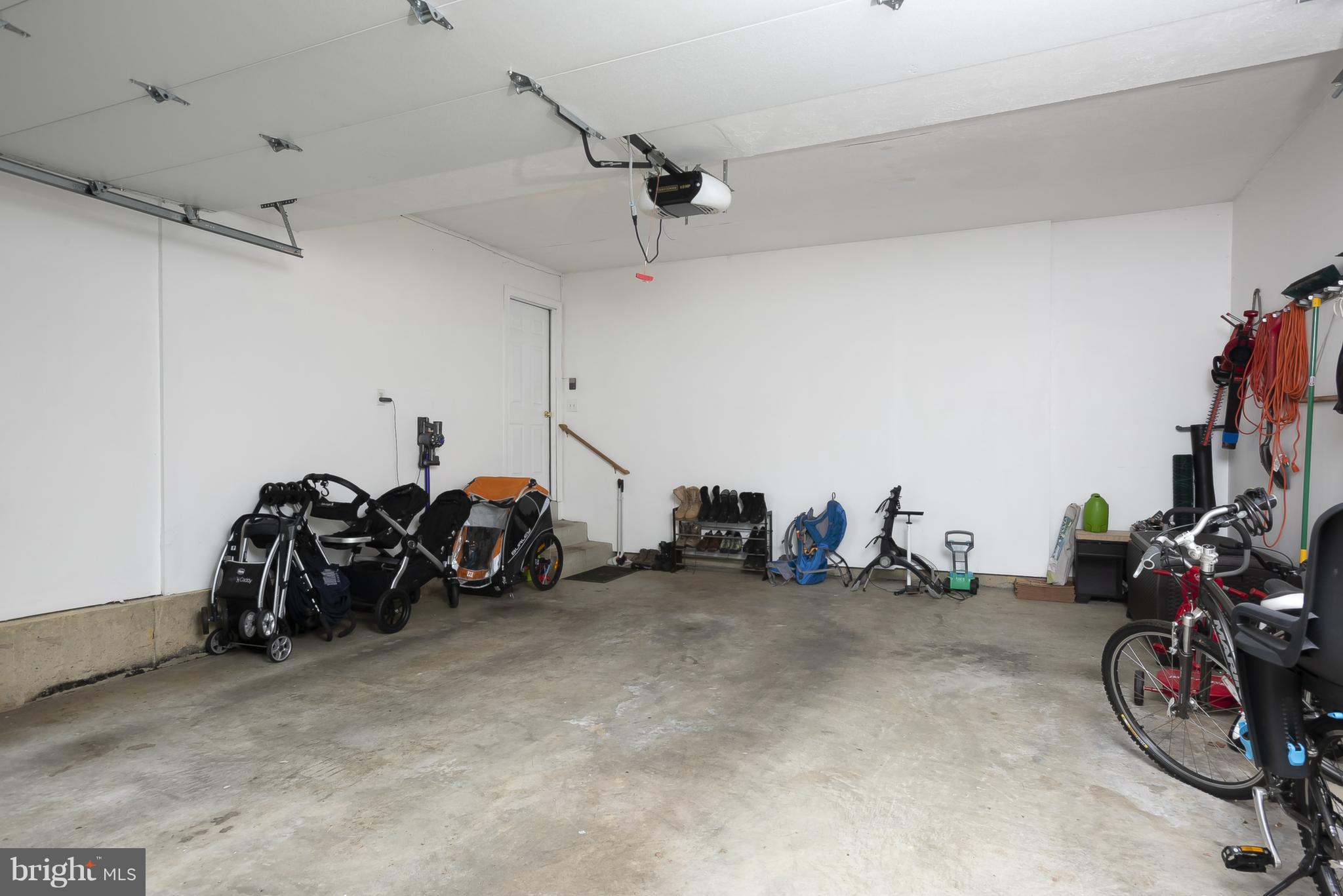 9550 Ridgeview Drive Columbia, MD 21046 - Photo 29 of 30 a view of a garage with a bike and a car