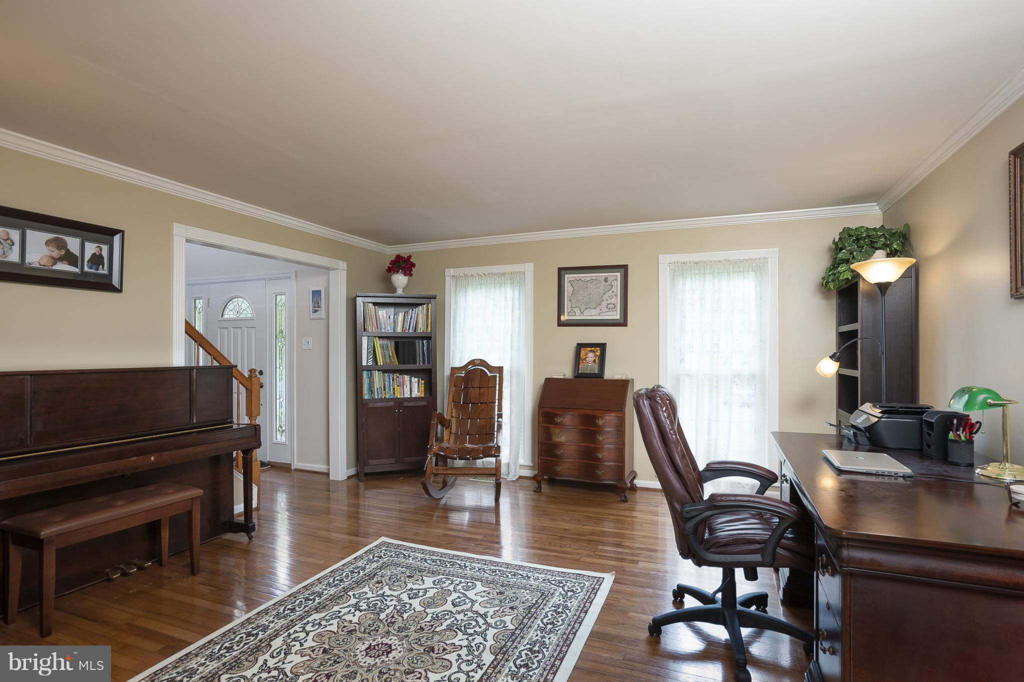 9550 Ridgeview Drive Columbia, MD 21046 - Photo 4 of 30 a living room with furniture and a piano