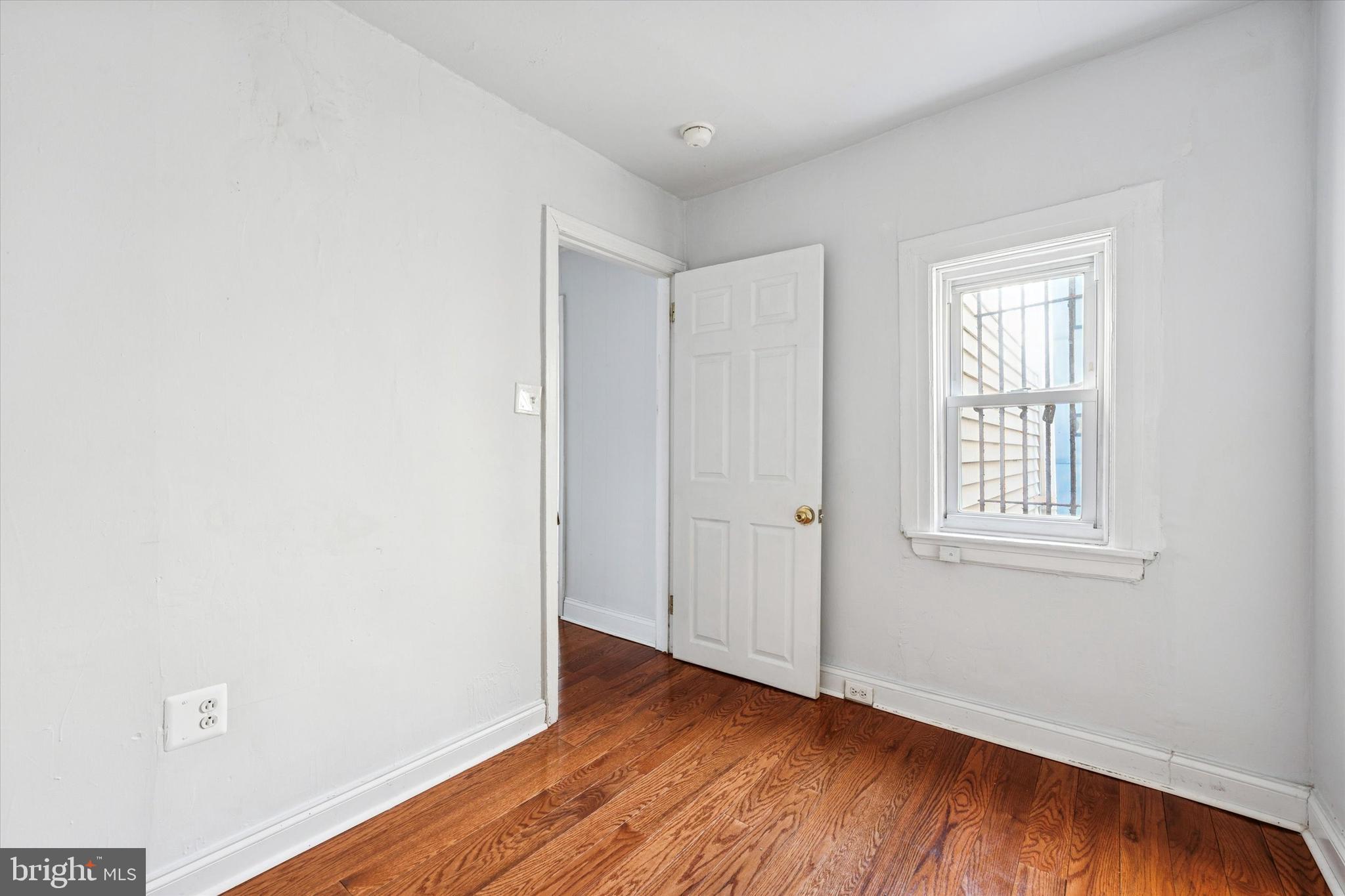 729 South Smedley Street Philadelphia, PA 19146 - Photo 16 of 25 an empty room with wooden floor and windows