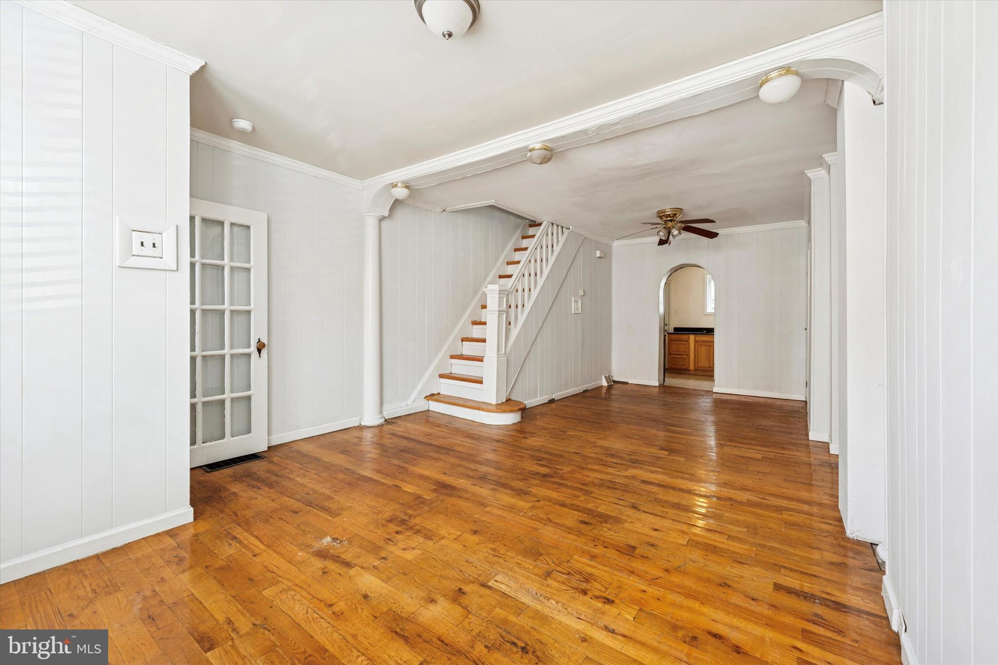 729 South Smedley Street Philadelphia, PA 19146 - Photo 6 of 25 a view of a room with wooden floor and stairs
