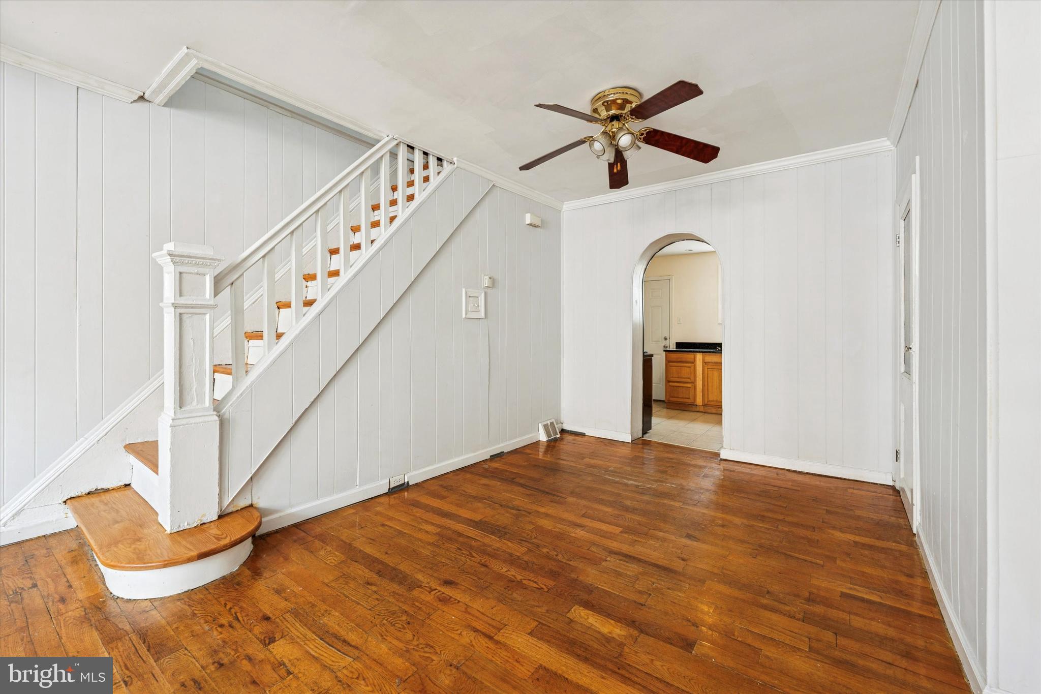 729 South Smedley Street Philadelphia, PA 19146 - Photo 8 of 25 a view of empty room with stairs and a chandelier