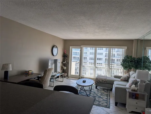 a workspace with furniture and a potted plant