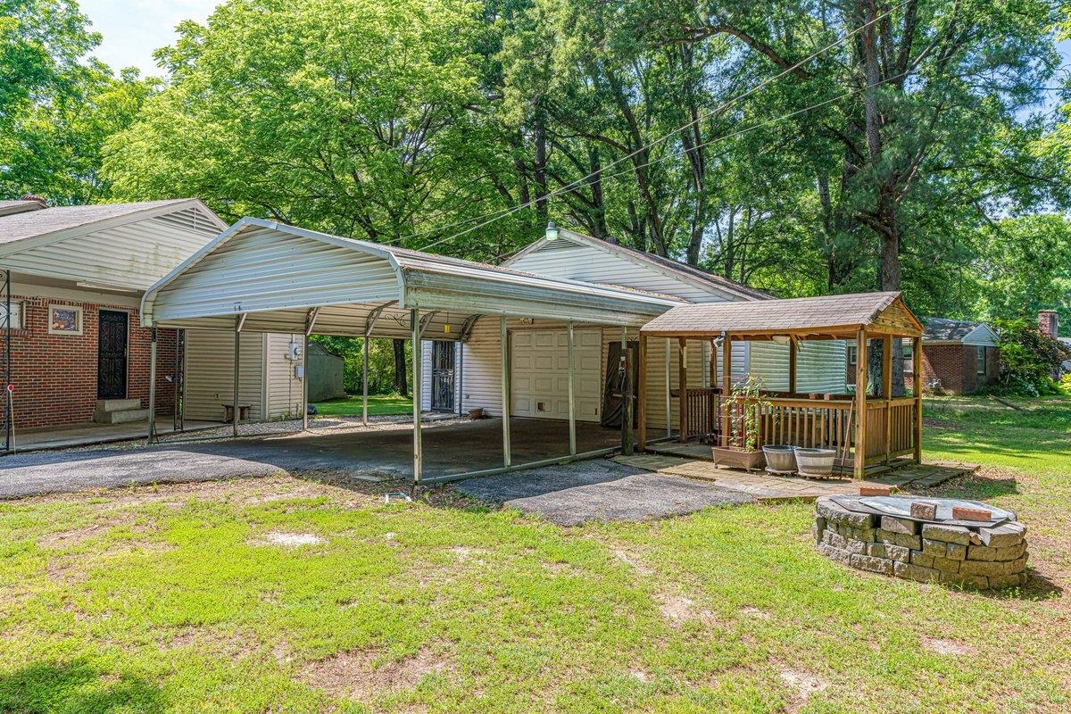 6237 Brunswick Road Arlington, TN 38002 - Photo 21 of 25 a backyard of a house with garden and patio