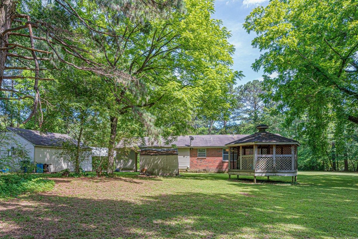 6237 Brunswick Road Arlington, TN 38002 - Photo 24 of 25 a front view of a house with a garden