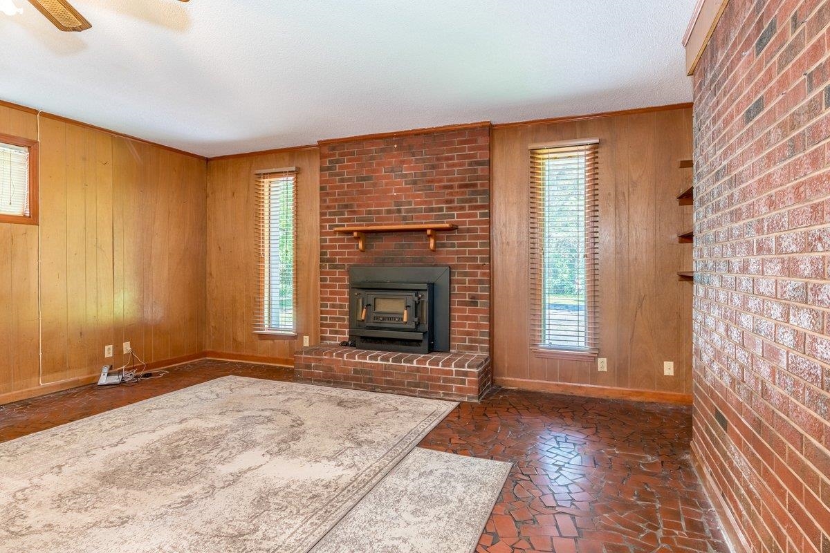 6237 Brunswick Road Arlington, TN 38002 - Photo 10 of 25 a view of an empty room with a fireplace and a window