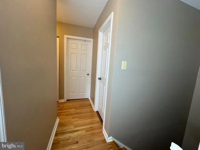 a view of a bathroom from the hallway