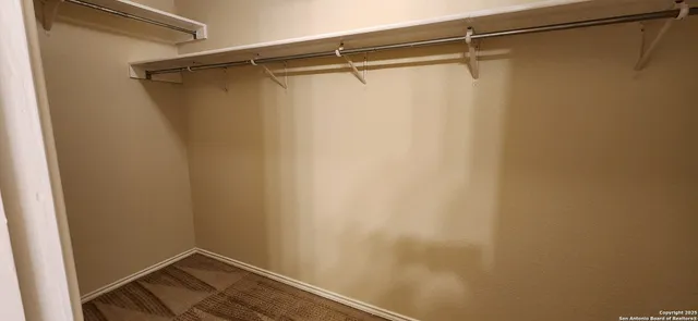 a bathroom with a sink a mirror and vanity