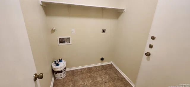 a view of a backyard with large trees