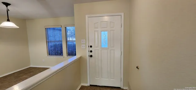 a view of an entryway with wooden floor