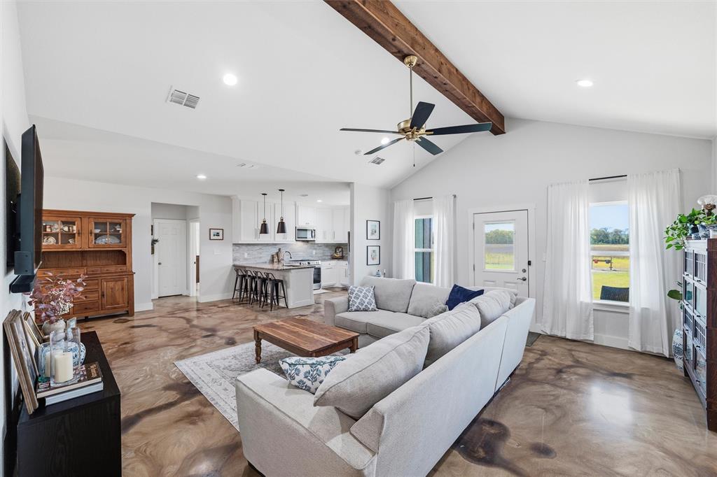 405 Advance Road Weatherford, TX 76088 - Photo 11 of 35 a living room with fireplace furniture and a flat screen tv