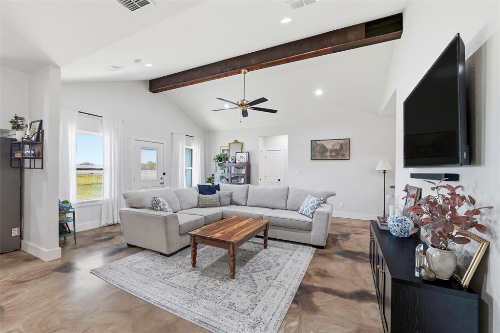 405 Advance Road Weatherford, TX 76088 - Photo 12 of 35 a living room with furniture and a flat screen tv