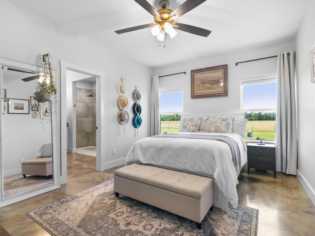 405 Advance Road Weatherford, TX 76088 - Photo 20 of 35 a bedroom with a bed couches and a window
