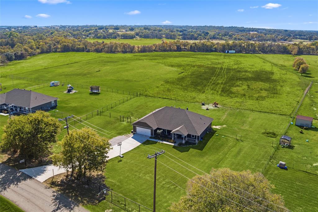 405 Advance Road Weatherford, TX 76088 - Photo 2 of 35 an aerial view of a houses with a yard