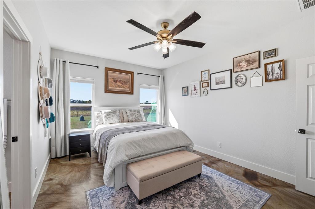 405 Advance Road Weatherford, TX 76088 - Photo 21 of 35 a bedroom with a bed and a window