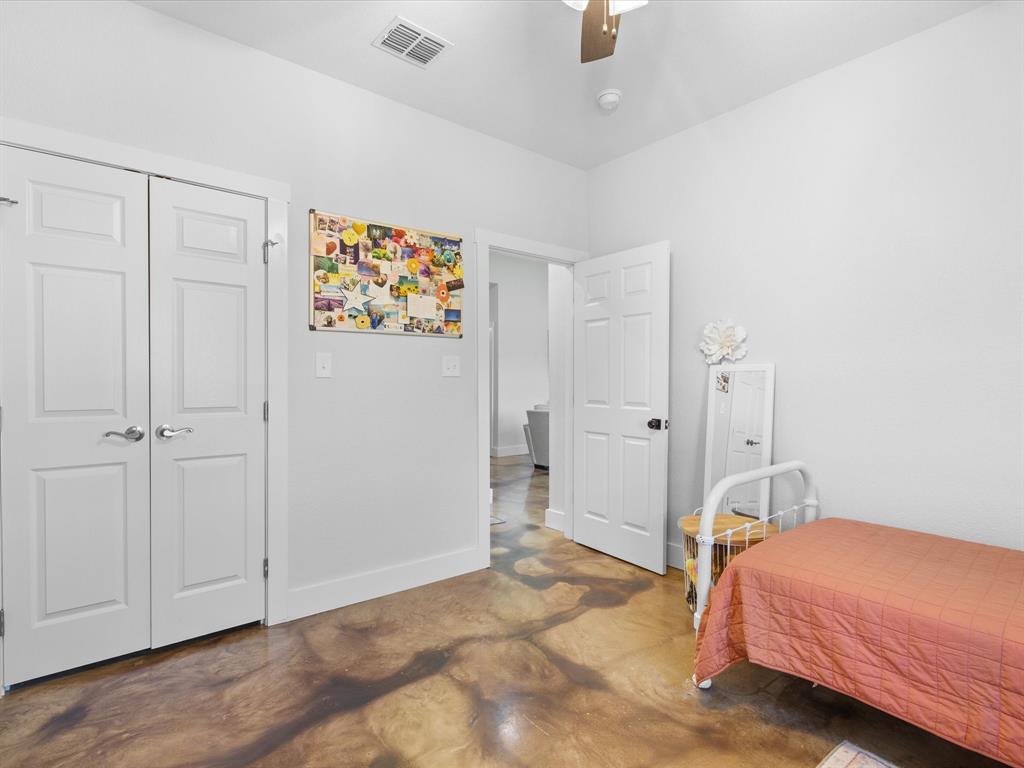 405 Advance Road Weatherford, TX 76088 - Photo 27 of 35 a bedroom with a bed and a view of bathroom