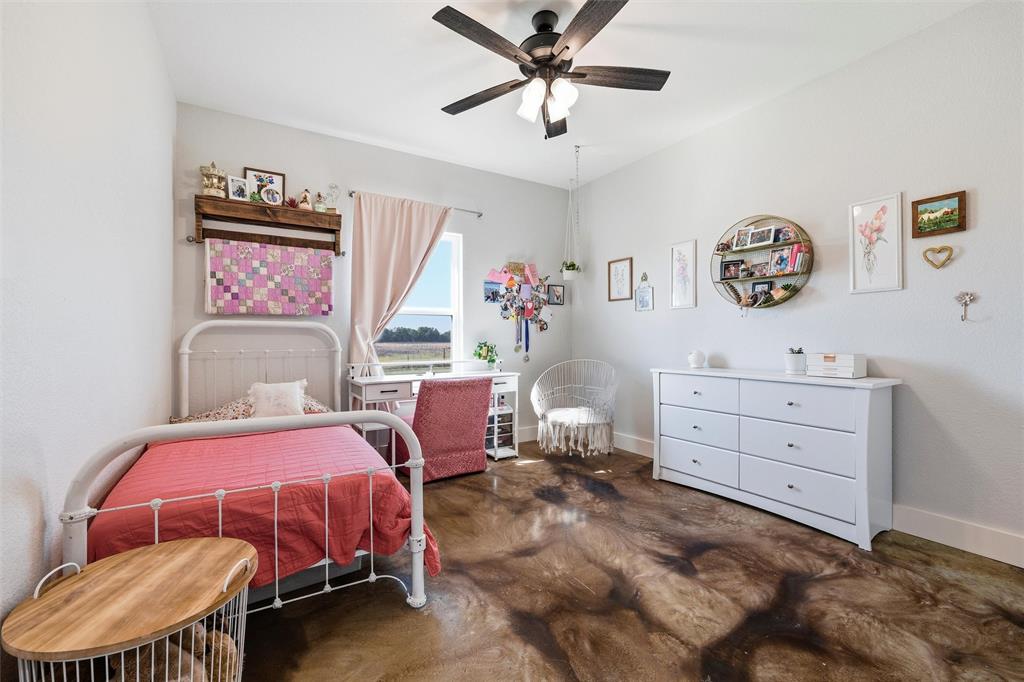 405 Advance Road Weatherford, TX 76088 - Photo 28 of 35 a bedroom with a bed and a furniture