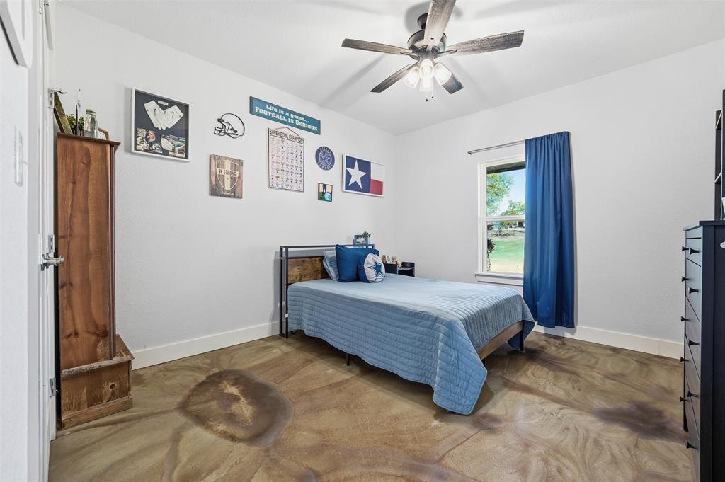 405 Advance Road Weatherford, TX 76088 - Photo 30 of 35 a bed room with a bed and a window