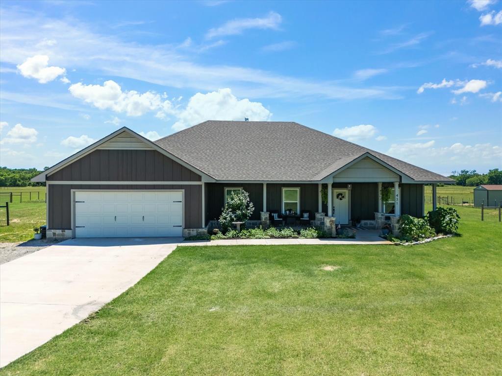 405 Advance Road Weatherford, TX 76088 - Photo 3 of 35 a front view of a house with a yard