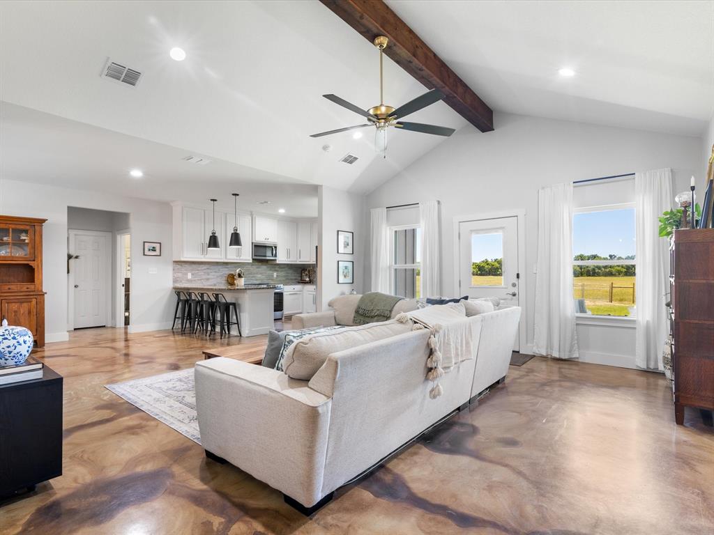 405 Advance Road Weatherford, TX 76088 - Photo 8 of 35 a living room with furniture and a large window