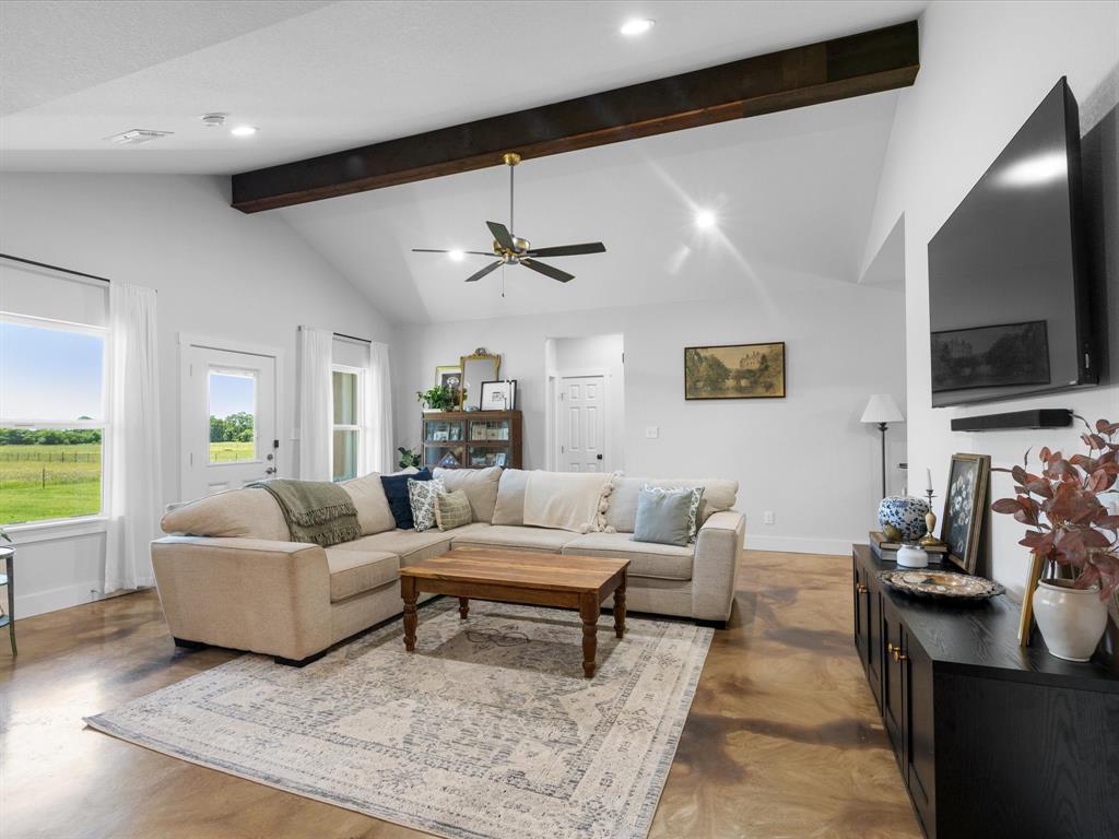 405 Advance Road Weatherford, TX 76088 - Photo 9 of 35 a living room with furniture and a flat screen tv