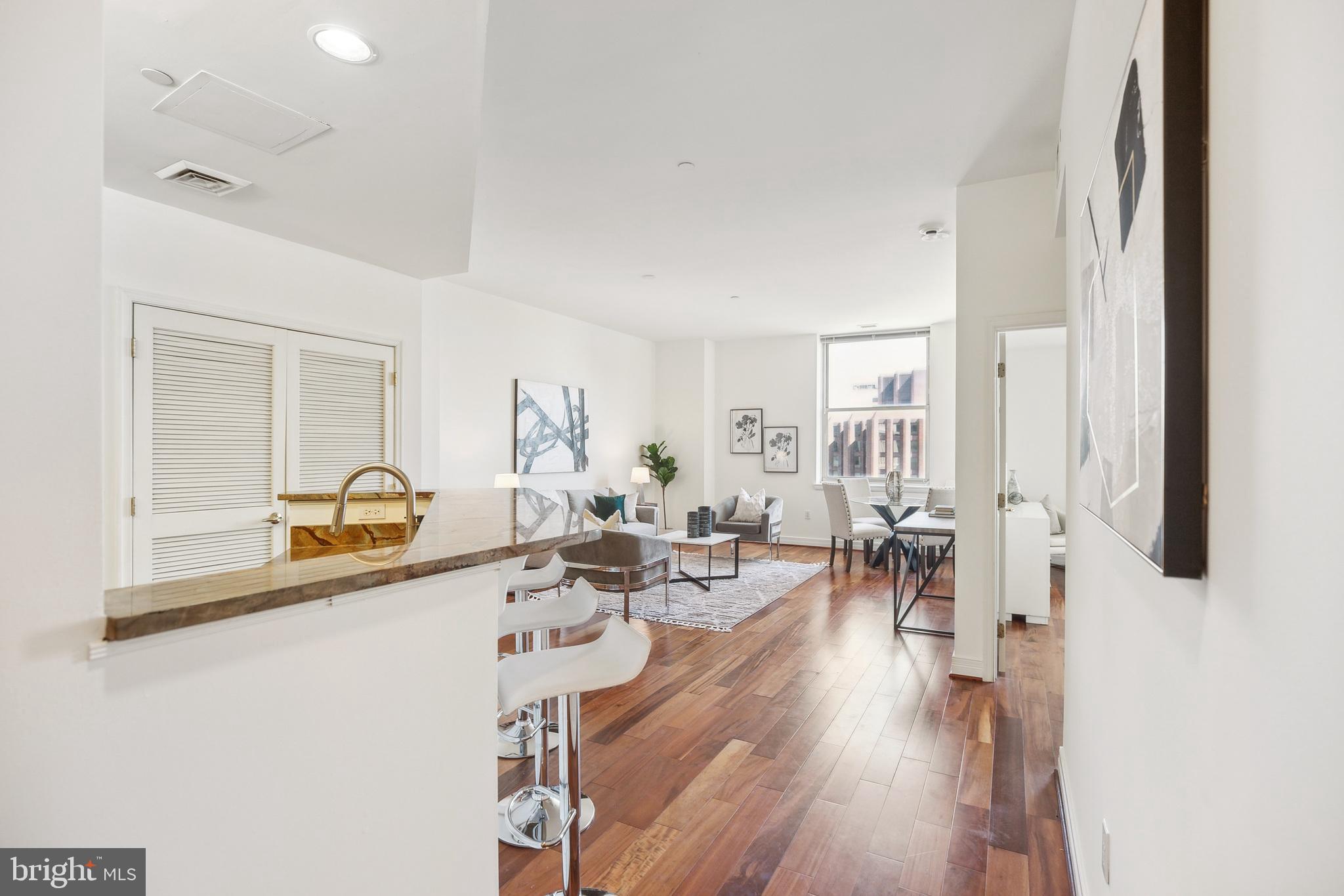1600-18 Arch Street, Unit 1801 Philadelphia, PA 19103 - Photo 3 of 13 a view of a livingroom with furniture and a wooden floor