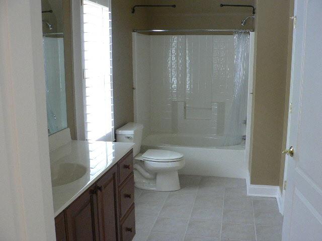 5251 Falcon Ridge Road Roanoke, VA 24018 - Photo 15 of 15 a bathroom with a granite countertop sink a toilet and shower