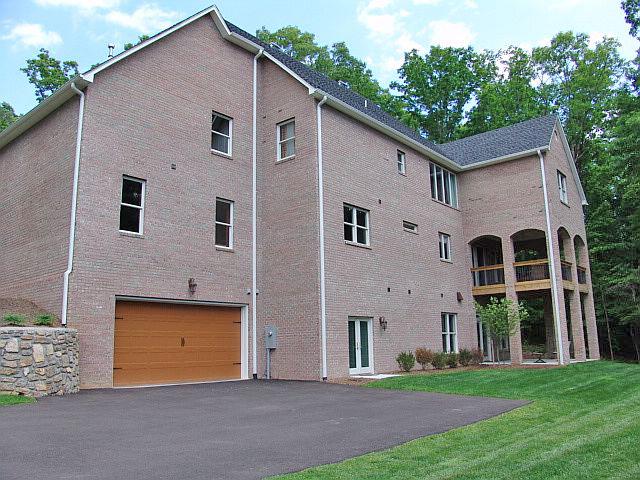 5251 Falcon Ridge Road Roanoke, VA 24018 - Photo 7 of 15 a view of a white house with yard and a large tree