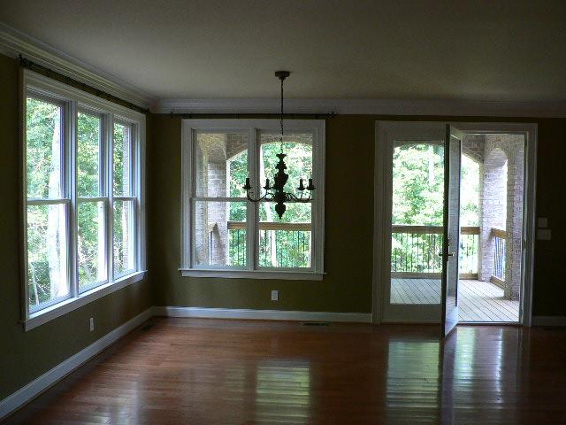 5251 Falcon Ridge Road Roanoke, VA 24018 - Photo 8 of 15 a view of an empty room with wooden floor and a window