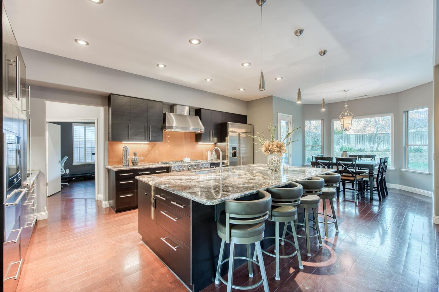 1081 North Harvard Avenue Clovis, CA 93611 - Photo 11 of 57 a kitchen with lots of counter top space and stainless steel appliances