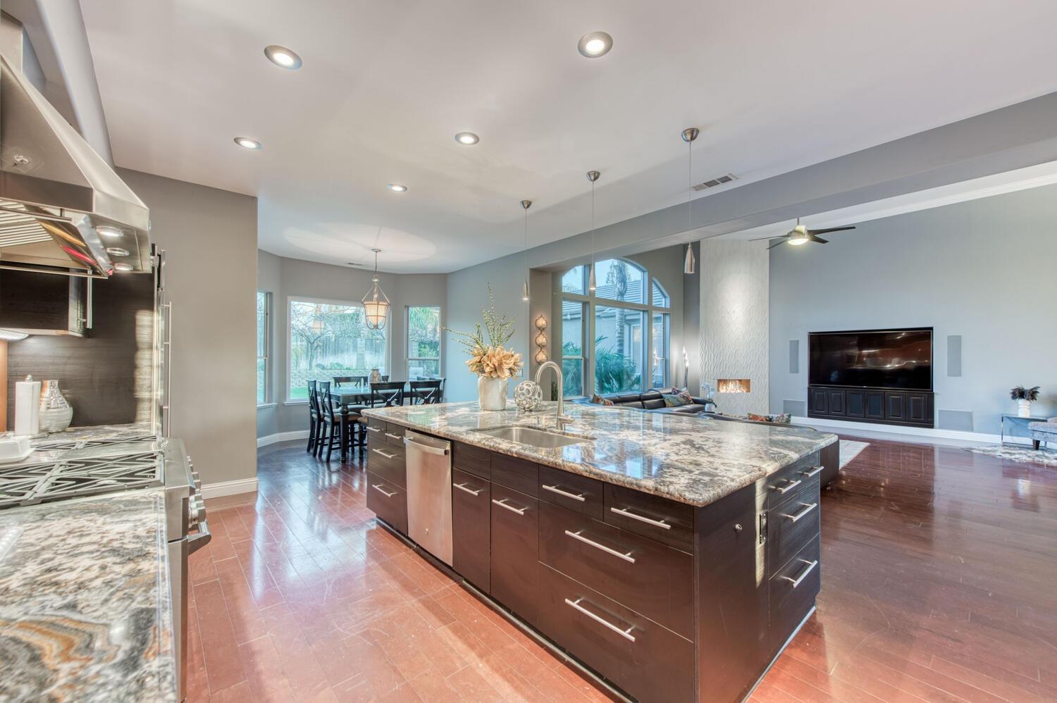1081 North Harvard Avenue Clovis, CA 93611 - Photo 12 of 57 a dining hall with stainless steel appliances granite countertop a stove and a sink