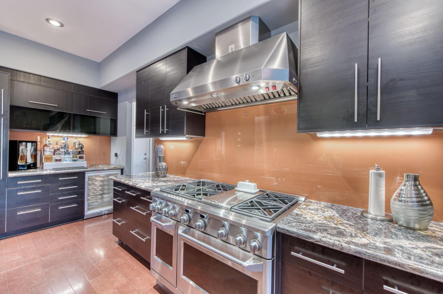 1081 North Harvard Avenue Clovis, CA 93611 - Photo 16 of 57 a kitchen with granite countertop a stove and a sink