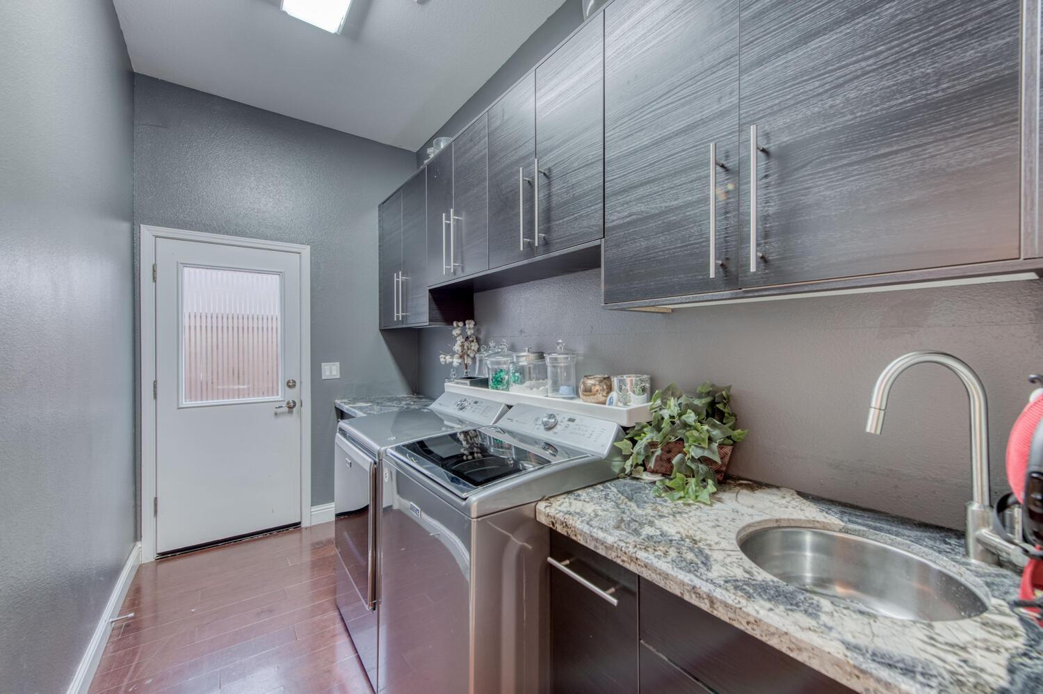 1081 North Harvard Avenue Clovis, CA 93611 - Photo 21 of 57 a kitchen with stainless steel appliances granite countertop a sink stove and cabinets