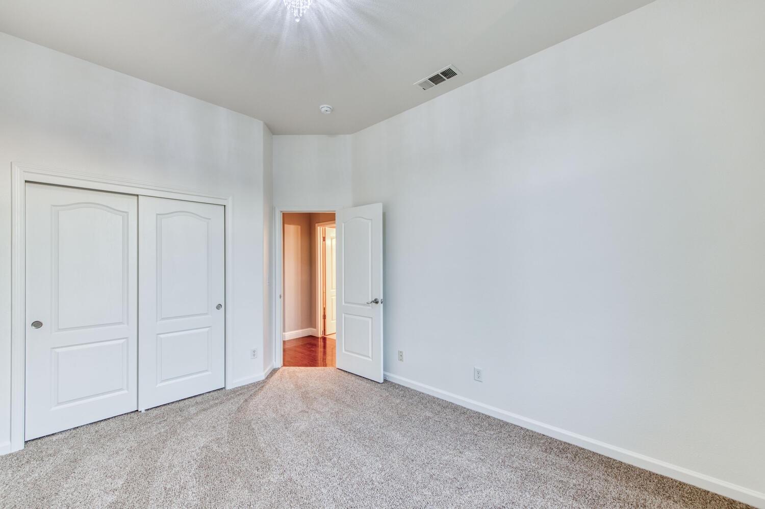 1081 North Harvard Avenue Clovis, CA 93611 - Photo 26 of 57 a view of an empty room and closet area