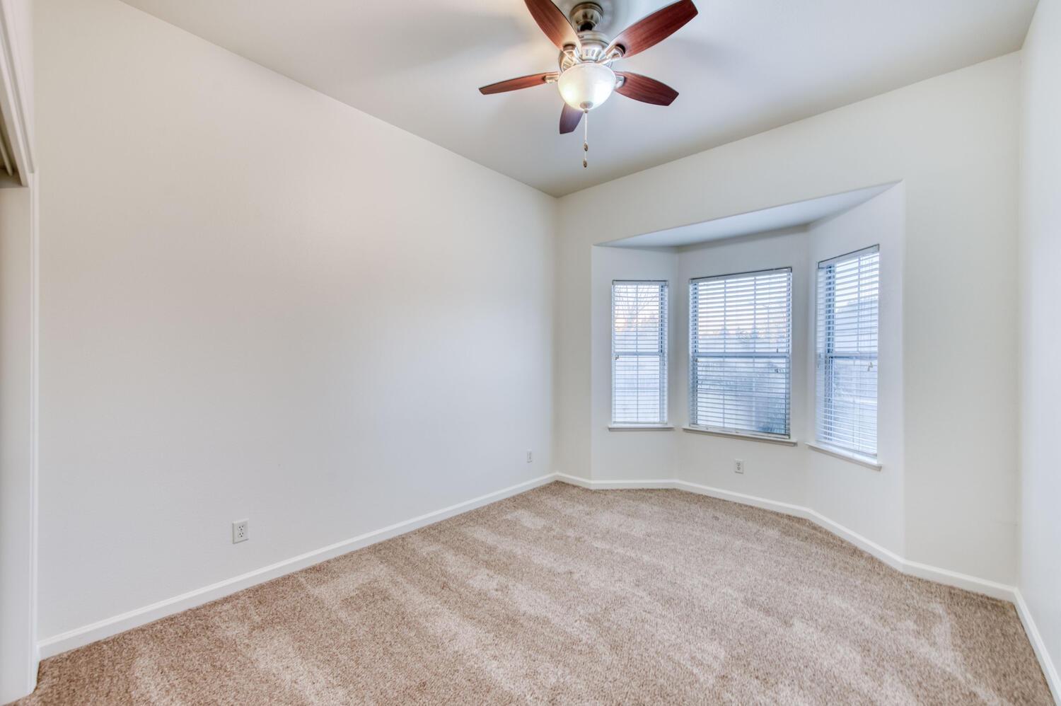1081 North Harvard Avenue Clovis, CA 93611 - Photo 27 of 57 a view of an empty room with a window