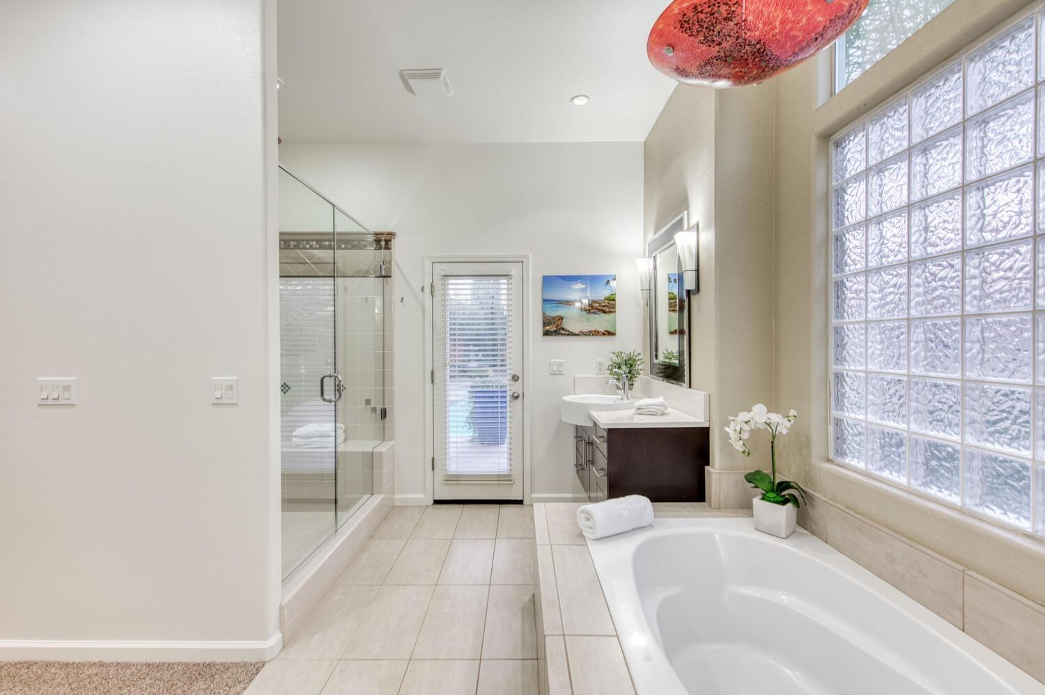 1081 North Harvard Avenue Clovis, CA 93611 - Photo 34 of 57 a bathroom with a tub sink shower and a mirror