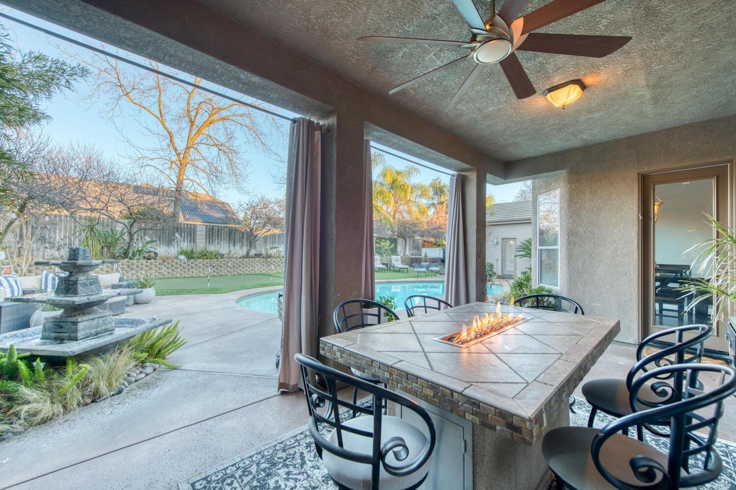 1081 North Harvard Avenue Clovis, CA 93611 - Photo 37 of 57 a view of a dining room with furniture window and outside view