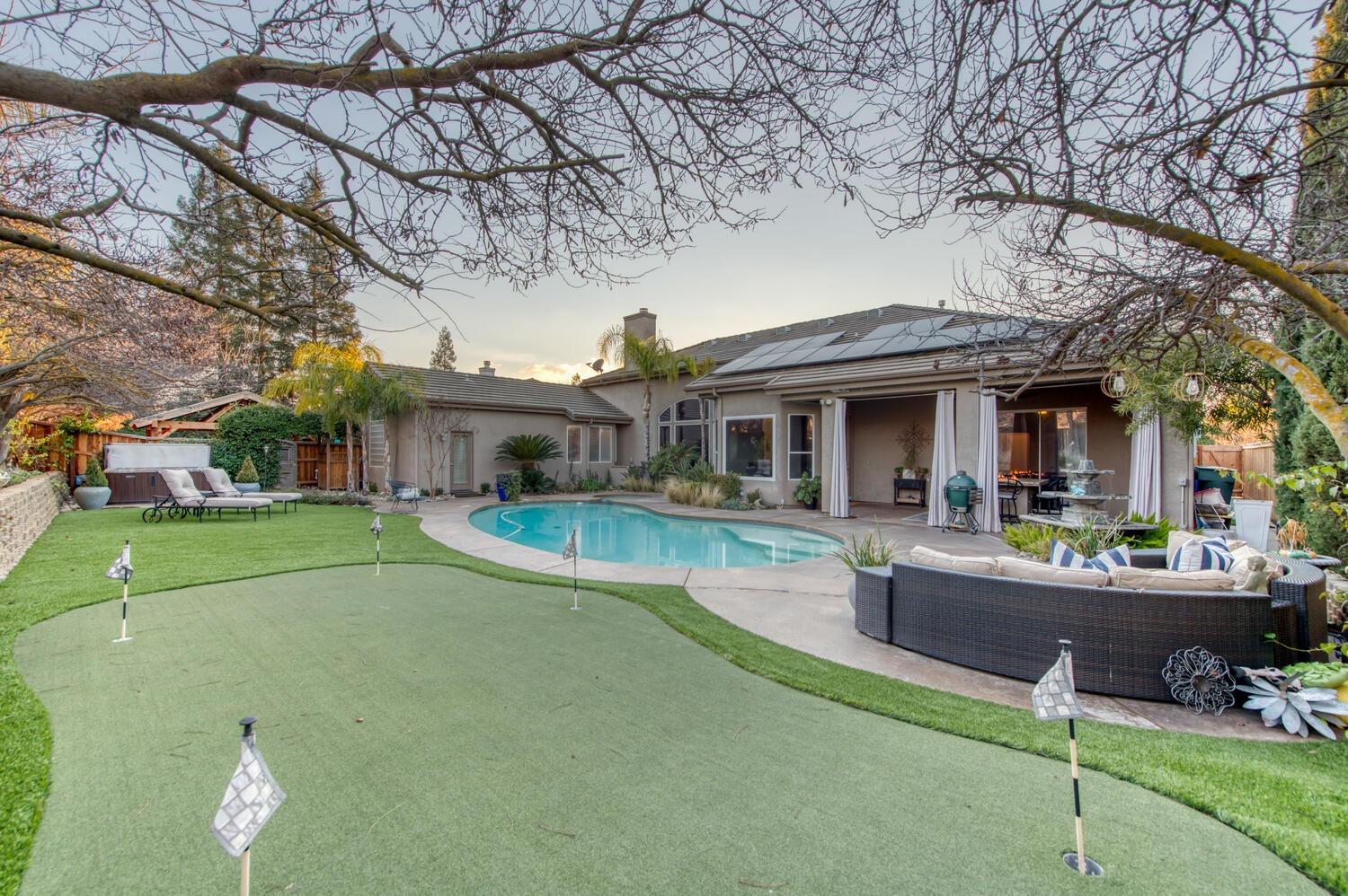1081 North Harvard Avenue Clovis, CA 93611 - Photo 40 of 57 a view of house with outdoor seating and city view