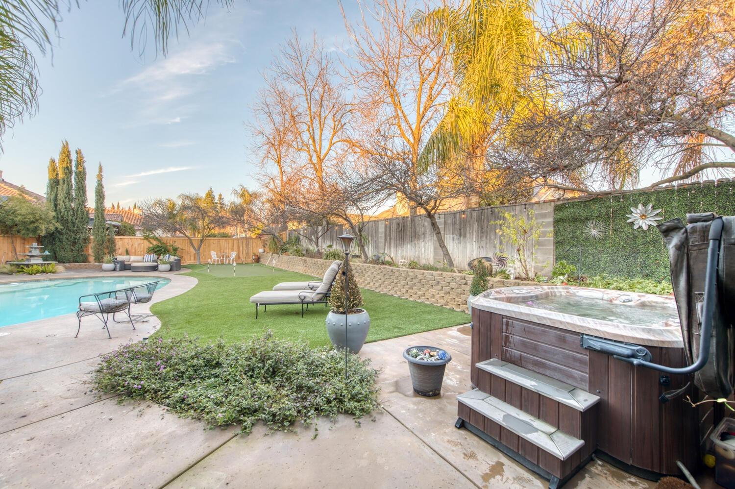 1081 North Harvard Avenue Clovis, CA 93611 - Photo 46 of 57 a view of a garden with sitting area