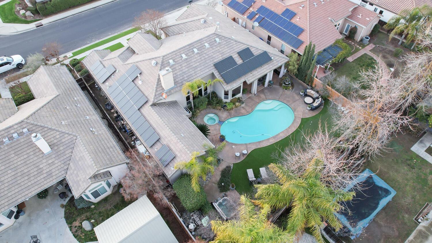 1081 North Harvard Avenue Clovis, CA 93611 - Photo 52 of 57 an aerial view of a house with a swimming pool