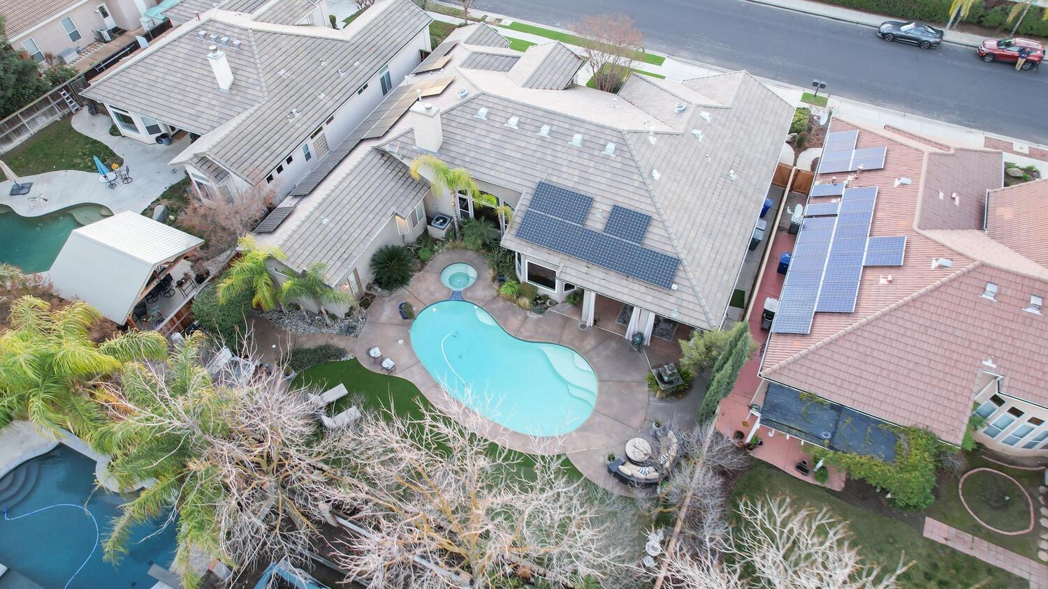 1081 North Harvard Avenue Clovis, CA 93611 - Photo 53 of 57 an aerial view of a house with a swimming pool