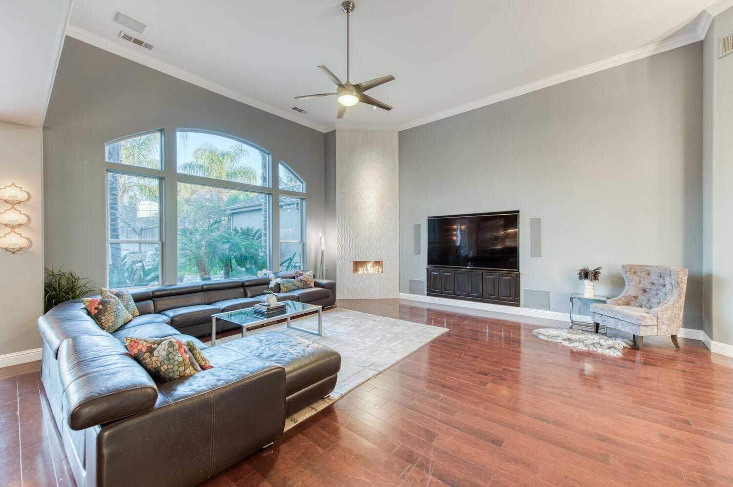 1081 North Harvard Avenue Clovis, CA 93611 - Photo 9 of 57 a living room with furniture and a flat screen tv
