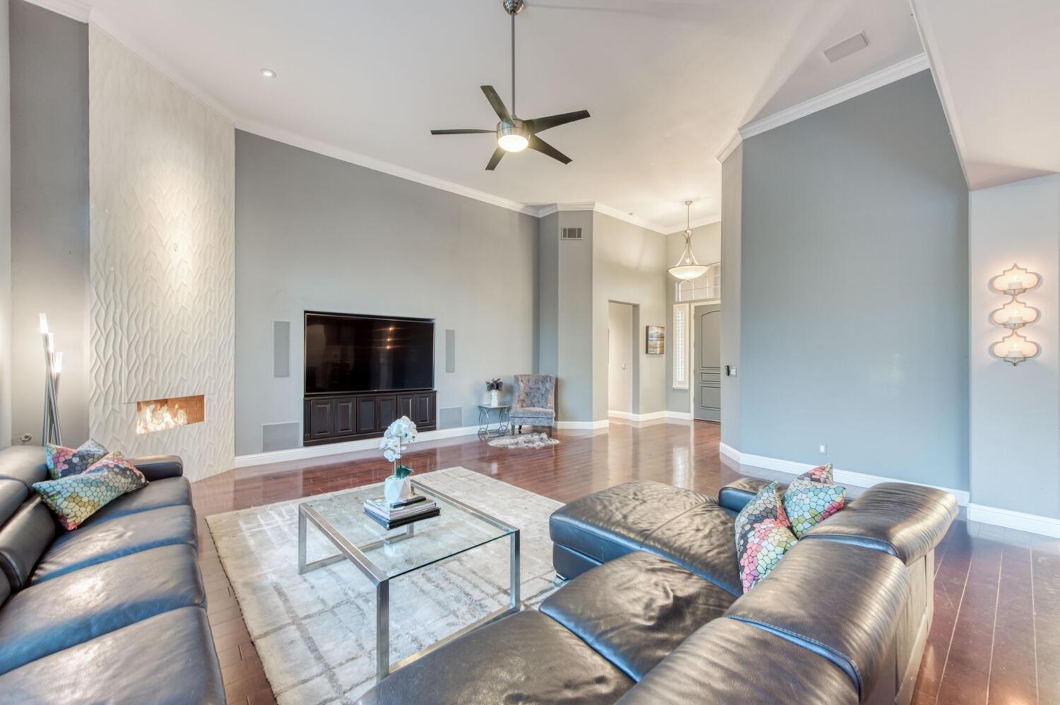 1081 North Harvard Avenue Clovis, CA 93611 - Photo 10 of 57 a living room with furniture and a flat screen tv