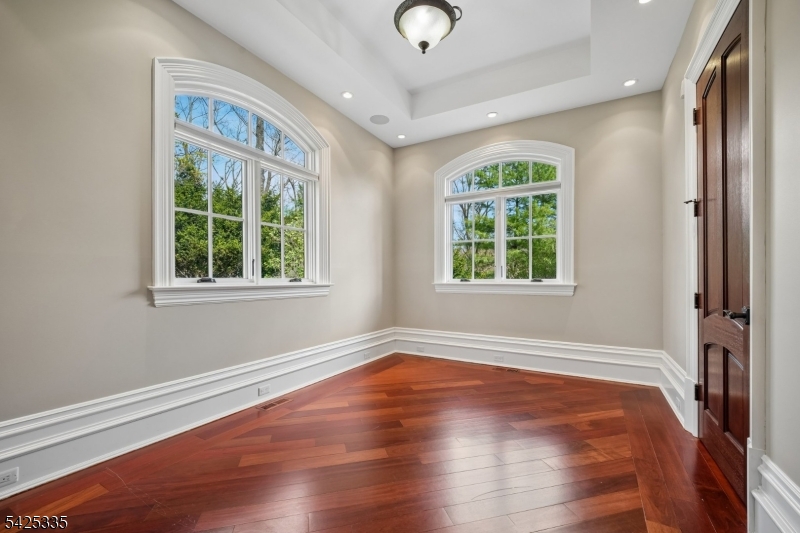 318 Franklin Road Denville, NJ 07834 - Photo 13 of 40 an empty room with wooden floor and windows