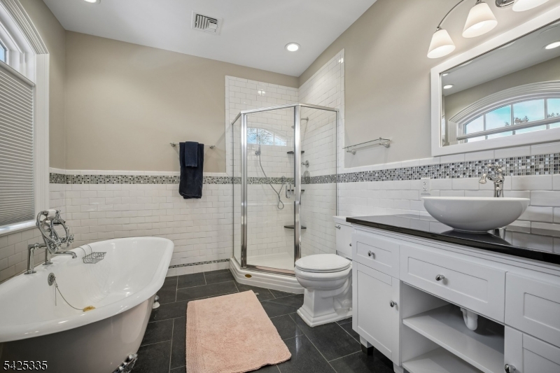 318 Franklin Road Denville, NJ 07834 - Photo 15 of 40 a bathroom with a toilet a sink and a mirror